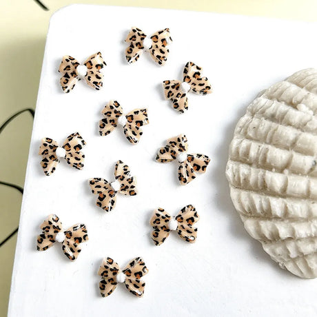 50pcs Leopard Print Bow Nail Art Decorations 10mm 3D Resin Leopard Ribbon Nail Charms Leopard Designs Acrylic Nail Art Supplies